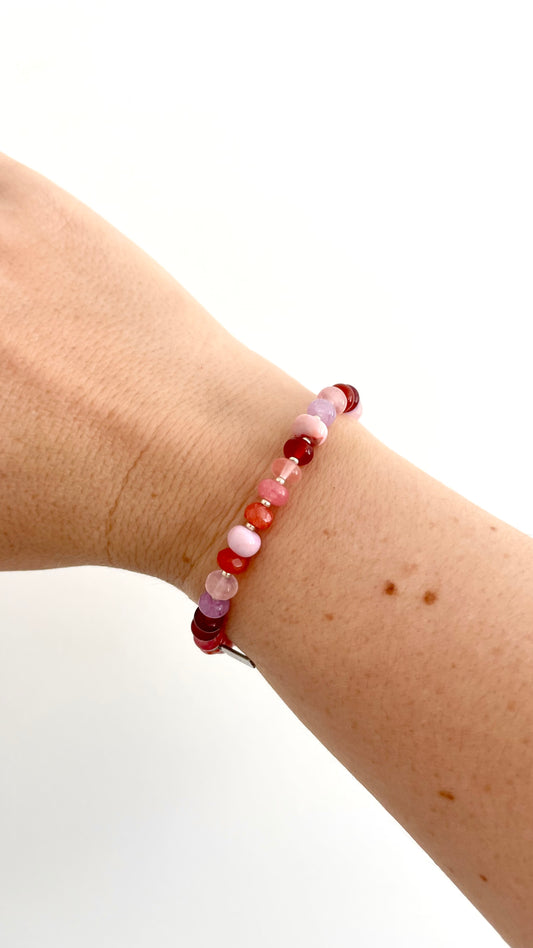 By Clemmie Opal stretch bracelet. Made with lilac and pink opal crystals.